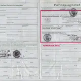 Niemiecki numer VIN na dokumencie Fahrzeugbrief. Widoczne wpisy dotyczące właścicieli i daty.