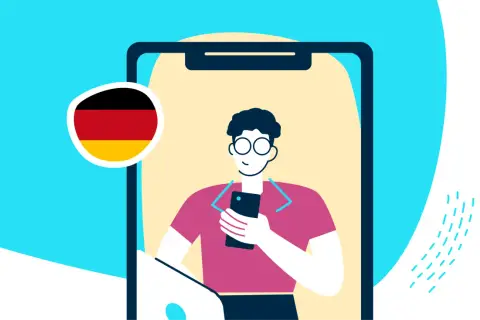 Chłopak z Niemiec ogląda Paryż na telefonie. Flaga Niemiec obok.