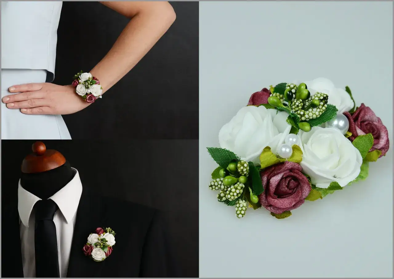 Elegancki corsage z białych i bordowych róż, zielonych dodatków i pereł, noszony na nadgarstku lub przypięty do marynarki.